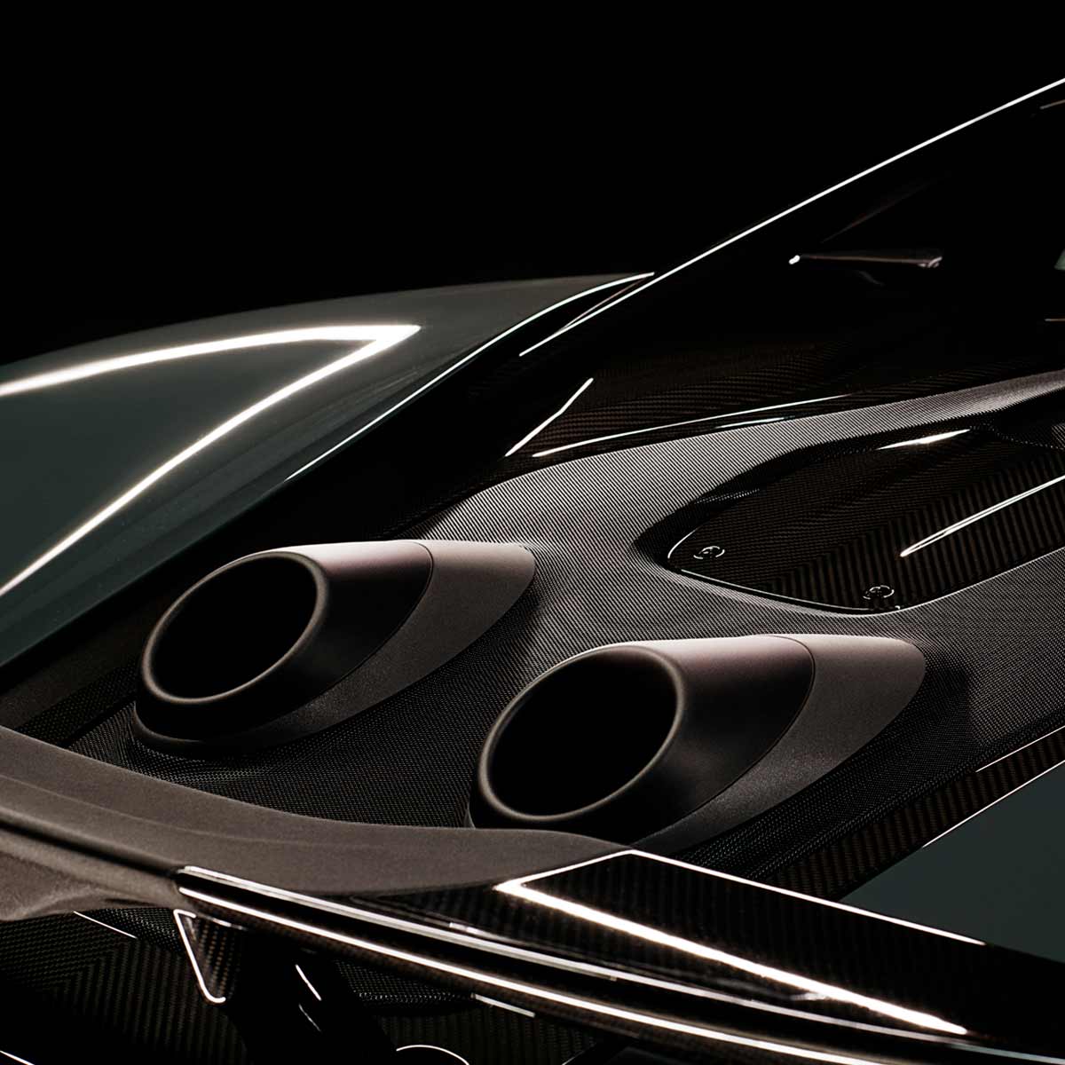 Close up detail of McLaren 600LT exhaust and carbon fibre surround.