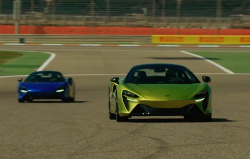 Deep Blue Racing Two McLaren sports cars, one in vibrant lime green and the other in ...