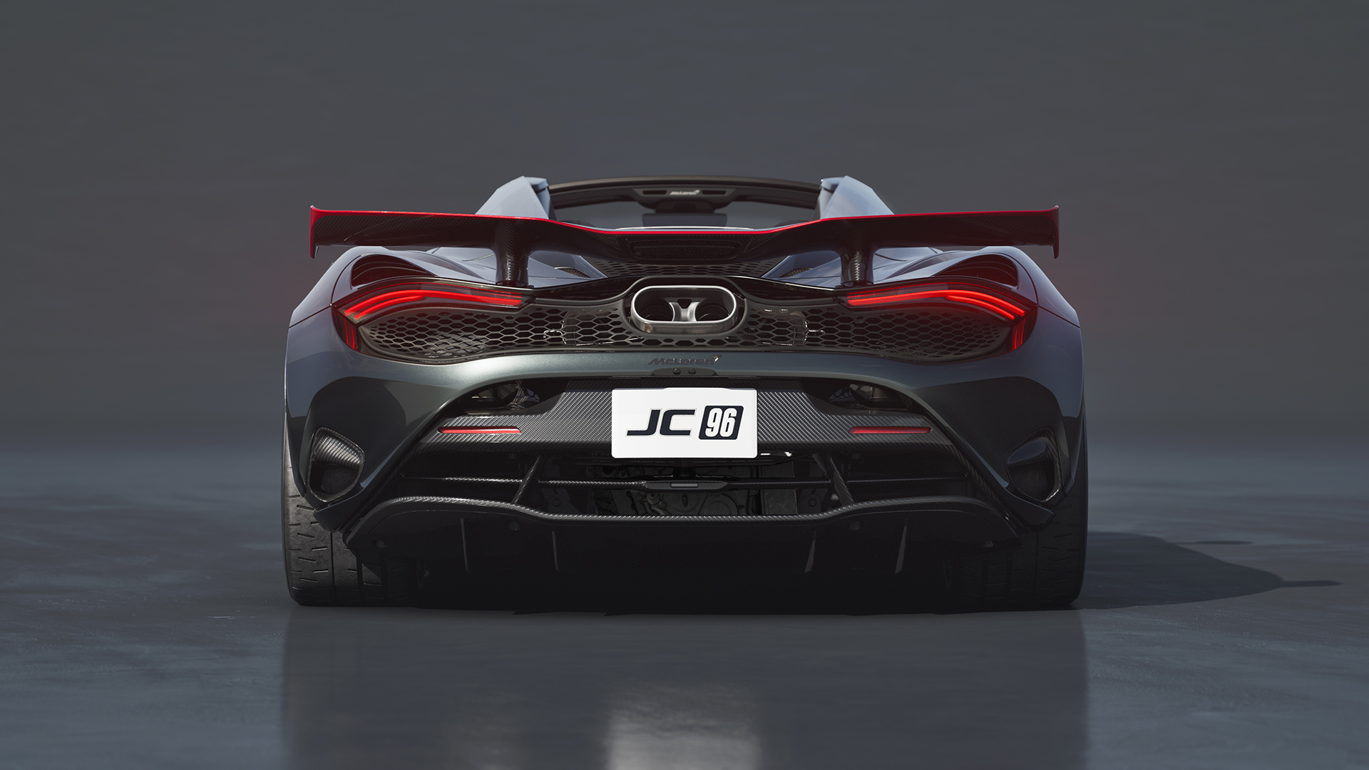 Rear view of the McLaren 750S JC96, showing its unique tail lights, exhaust, and custom "JC 96" license plate.