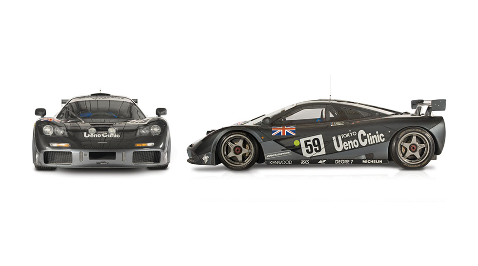 Front and side view of the black McLaren F1 GTR, with the number 59 painted on the body, covered in sponsorship stickers. Shown on a white background.