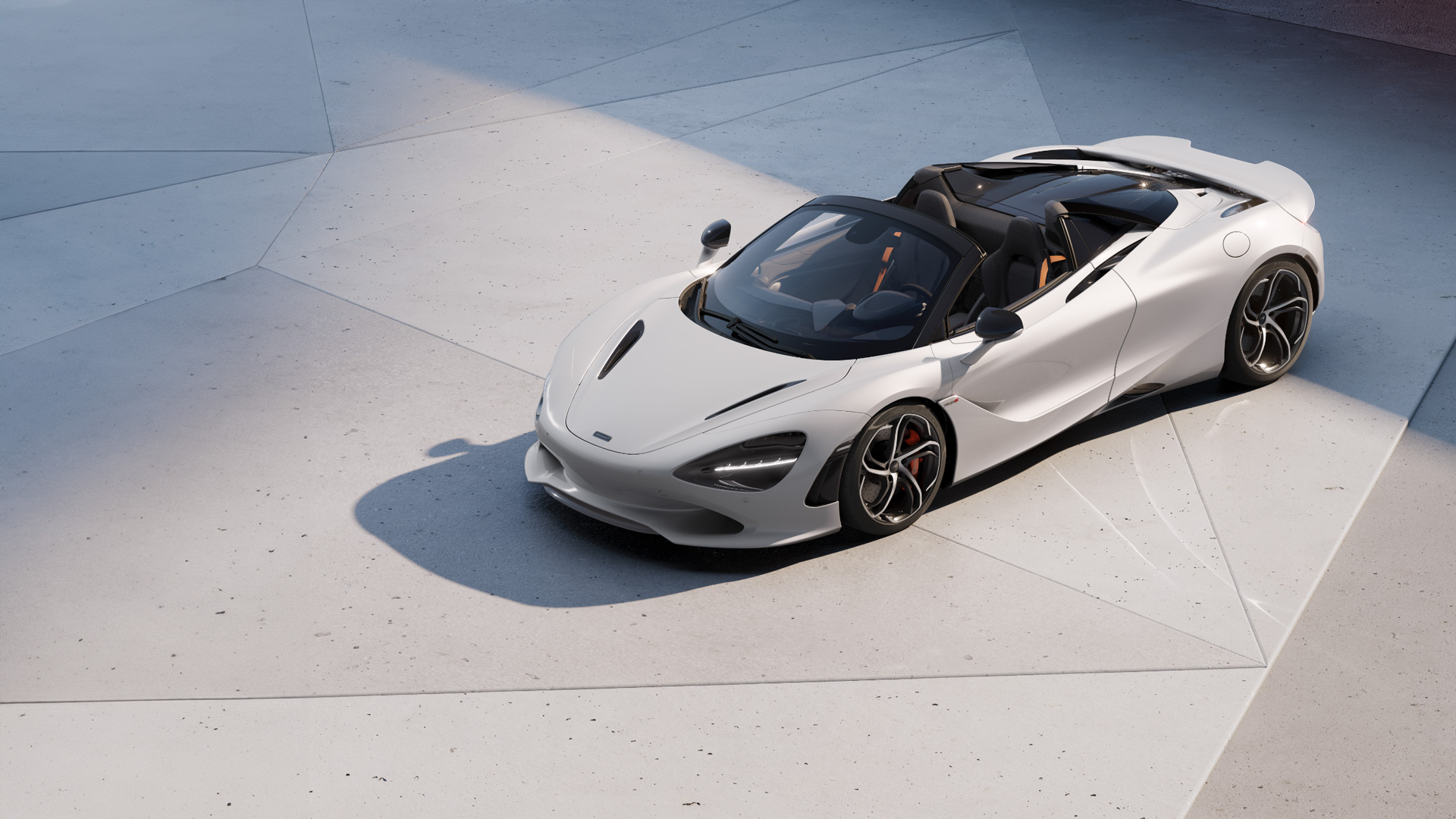 McLaren 750S Spider convertible in white paint, shown parked outdoors in geometric architectural lighting. The luxury open-top supercar features black and orange interior accents, highlighting performance and convertible dynamics.
