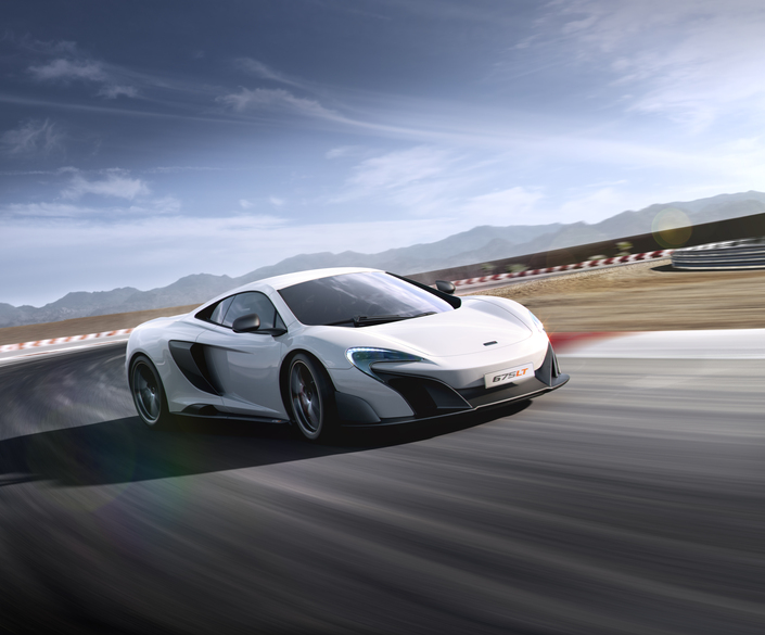 The McLaren 675LT, a longtail supercar, cornering on a racetrack at high speed.