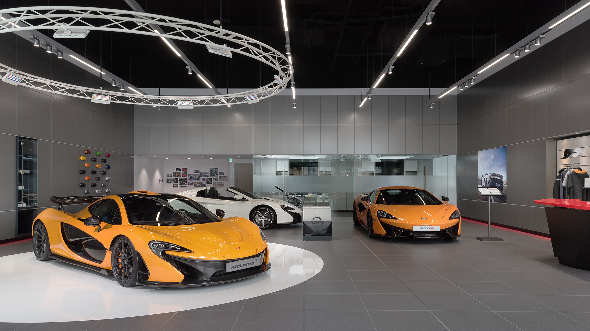 Various McLaren cars on display in the Kaohsiung McLaren showroom.