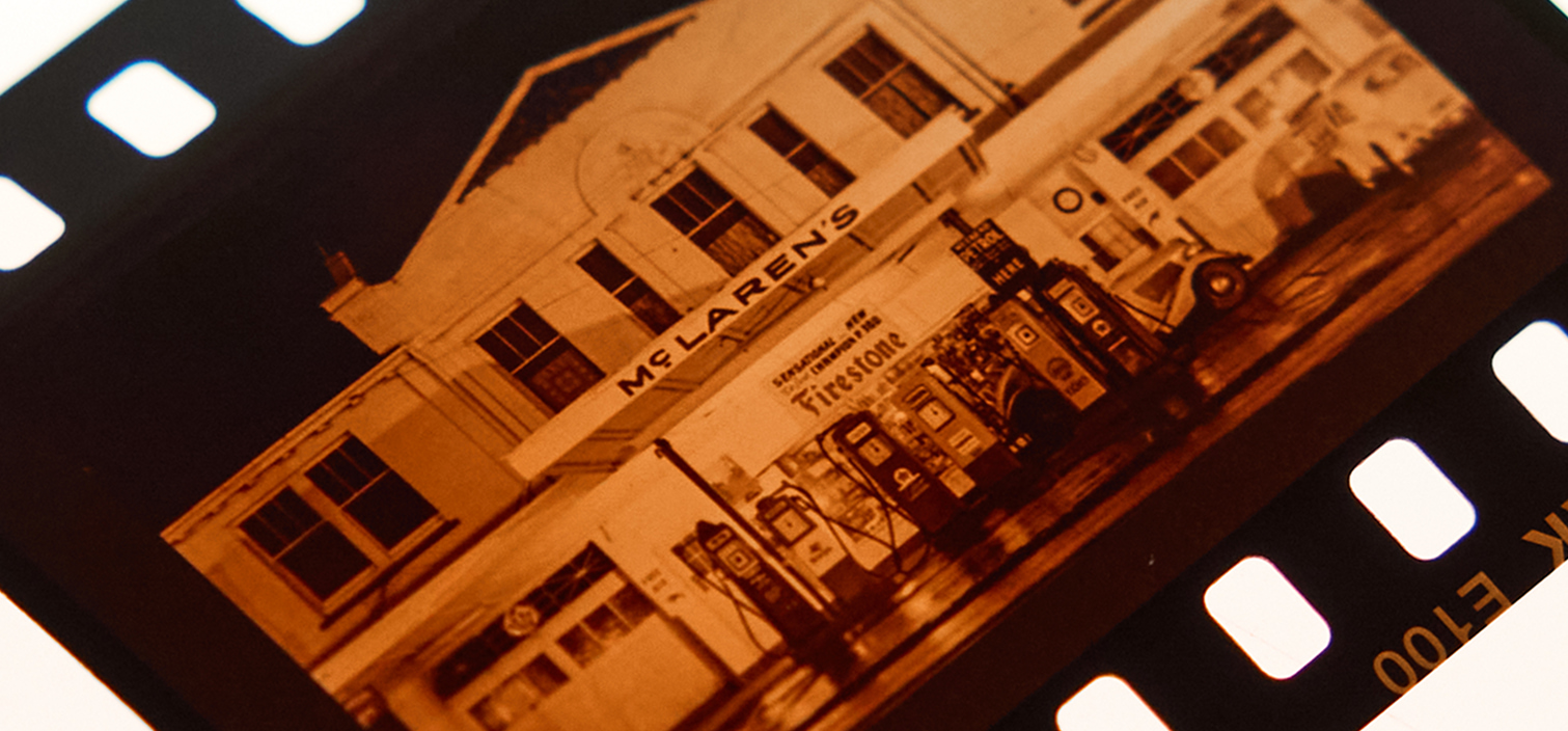 Vintage, sepia-toned film of the McLaren Service Station
